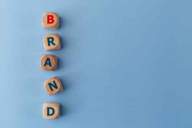 Photo word band on wooden cubes on a blue background business concept brand identity or awareness concept