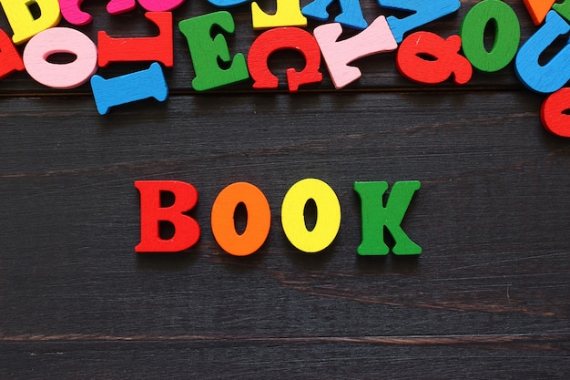 The word book with colored letters