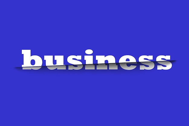 Photo the word business is creatively cut on a blue background