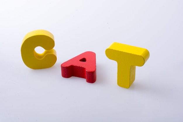 Photo the word cat written with letter blocks