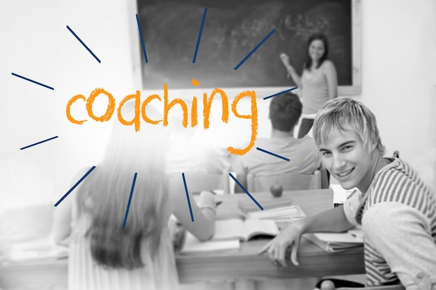 Photo the word coaching against students in a classroom