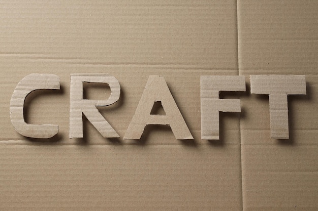 The word CRAFT is cut out of cardboard