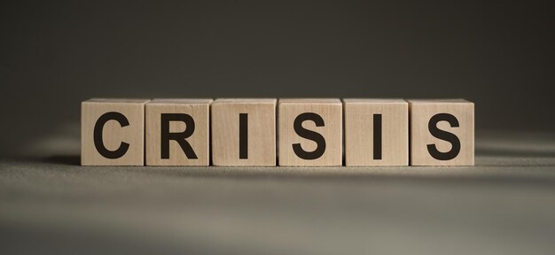 the word crisis written in cubes on a black background