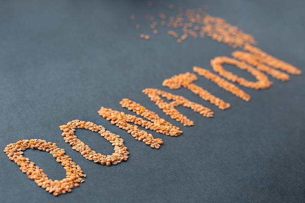 The word donate made from cereals on a black background