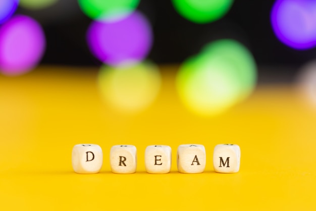 The word dream on colorful blur bokeh lights