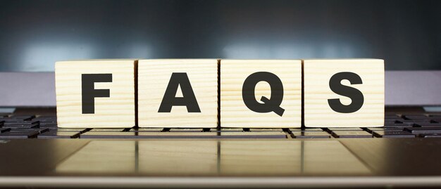 Word FAQS in wooden cubes with letters