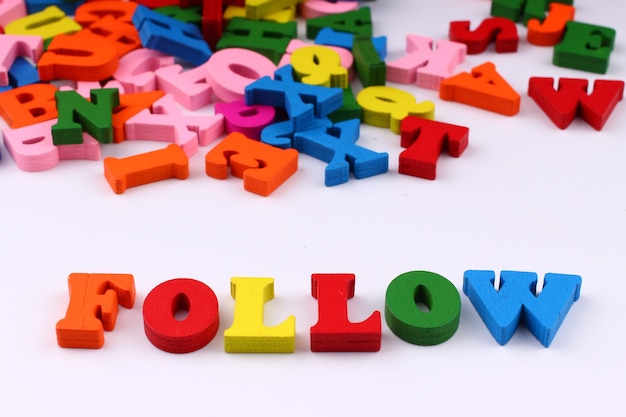 The word follow with colored letters