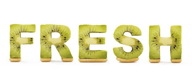 Photo word fresh made from kiwi letters isolated on white background