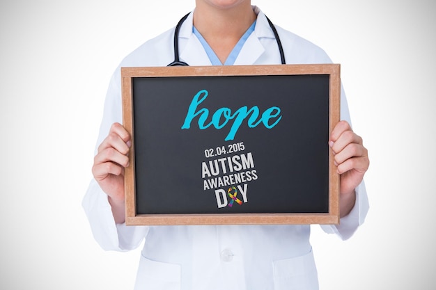 Photo the word hope and doctor showing little blackboard against autism awareness day