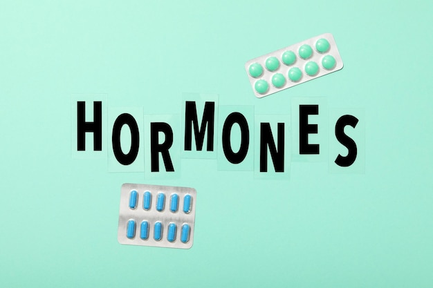 The word hormones on a light background