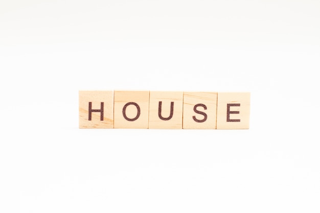 Word HOUSE made of wooden blocks isolated