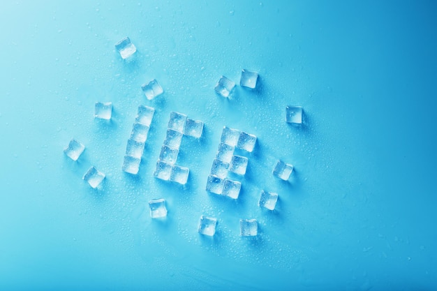 The word ice is a pattern of ice cubes on a blue background