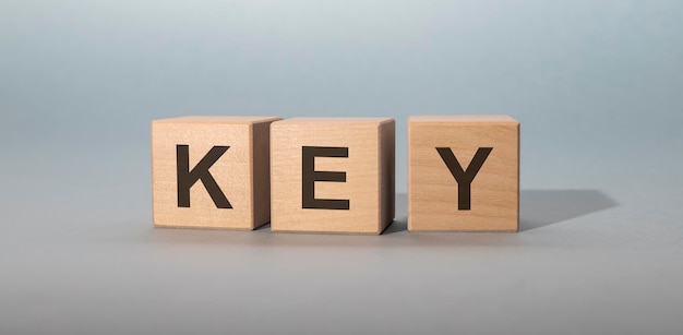 word key on wooden cube blocks on white grey background