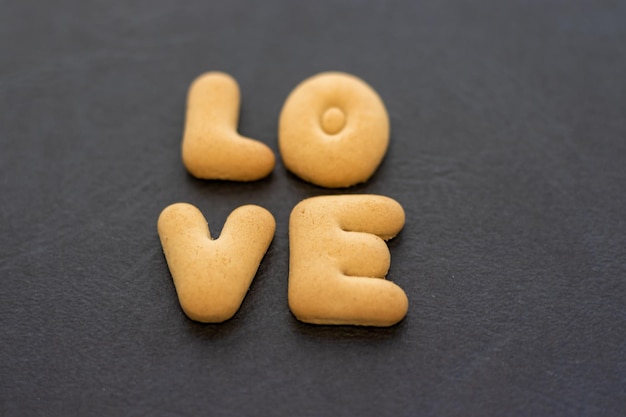 word love from little cookies on black background valentines day love concept