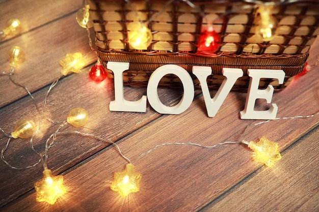 word Love from wooden letters on a wood background