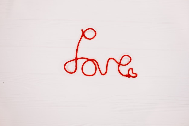 word "love" on wooden background