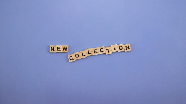 Photo the word new collection spelt with wooden letters