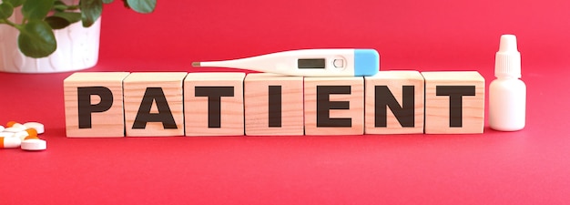 The word PATIENT is made of wooden cubes.