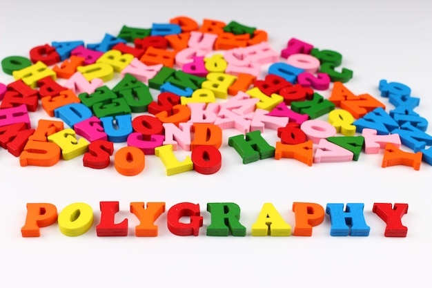 The word polygraphy with colored letters