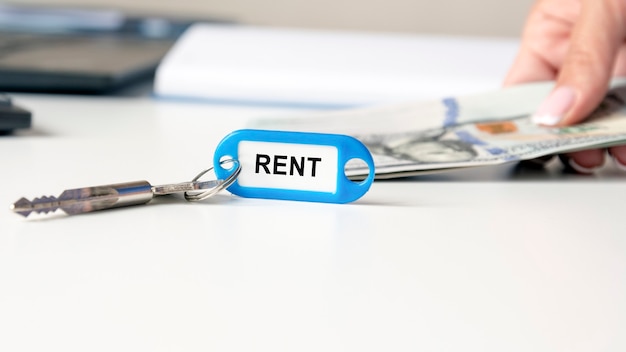 The word rent is written on the blue key fob