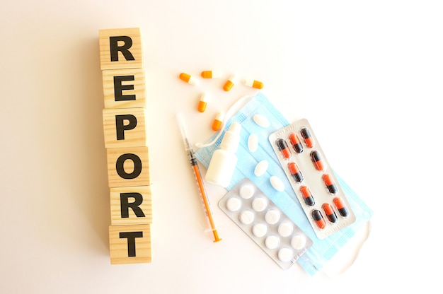 The word REPORT is made of wooden cubes