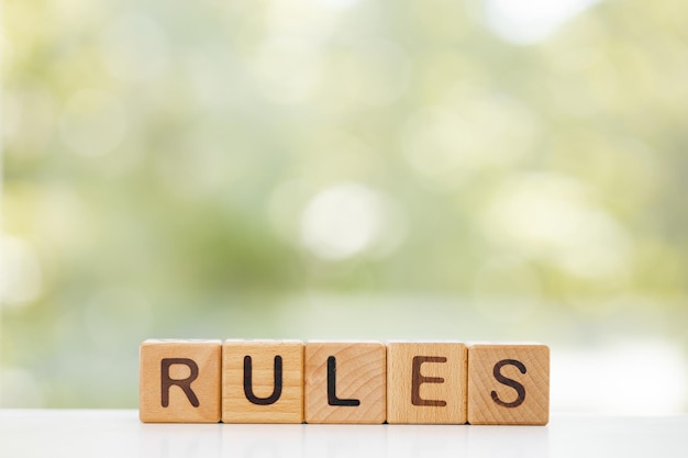 The word rules on wooden cubes