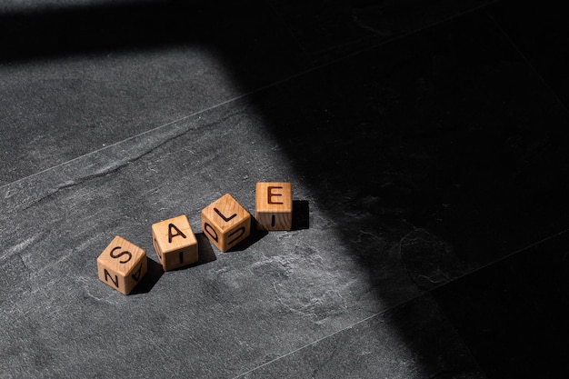 The word Sale on wood cubes Business and finance concept