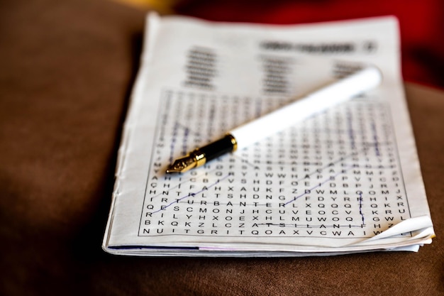 word search puzzle with elderly hands and dramatic lighting and reflection