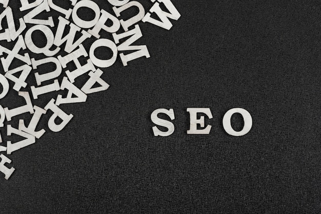 Photo word seo is composed of white letters on black background. website optimization