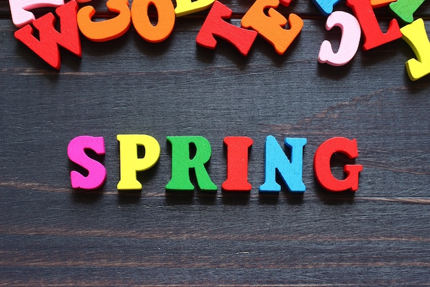 The word spring with colored letters