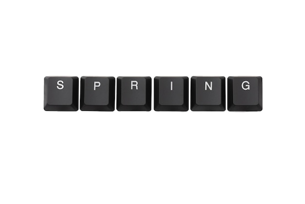 Photo word spring written on keyboard. isolated on white. top view.