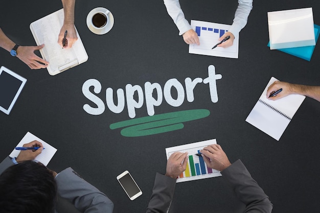 The word support and business meeting against blackboard