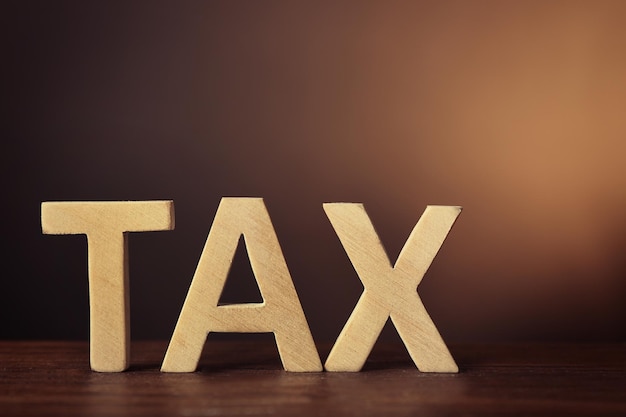 Word TAX on dark background