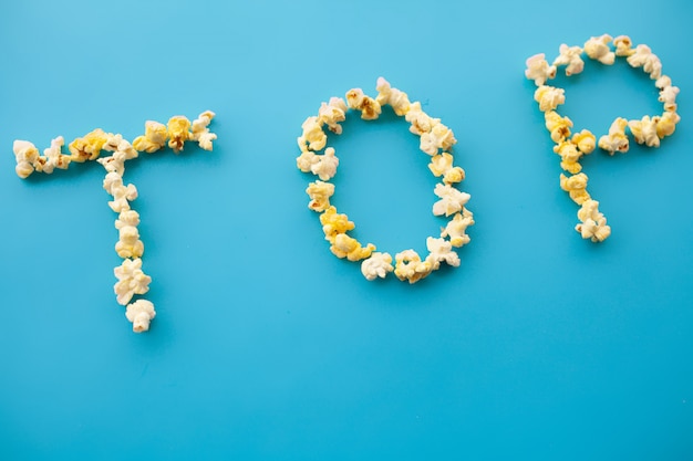 Word Top. Popcorn bucket. Delicious Popcorn. Cinema.