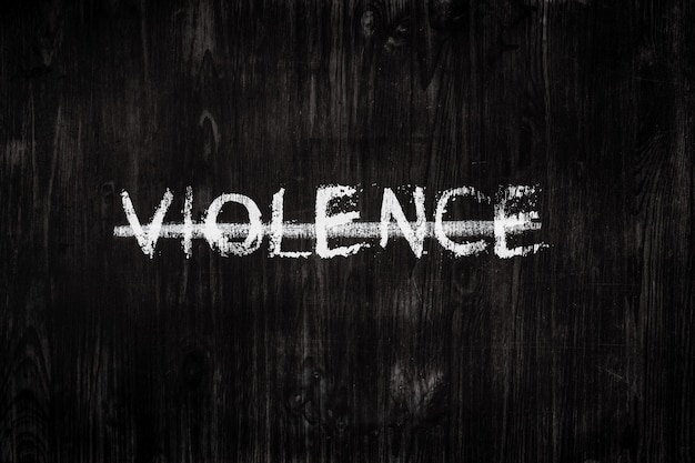 the word violence on a blackboard