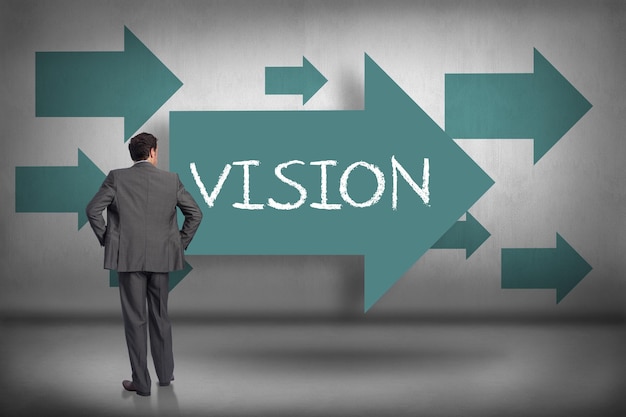 Photo the word vision and businessman with hands on hips against blue arrows pointing