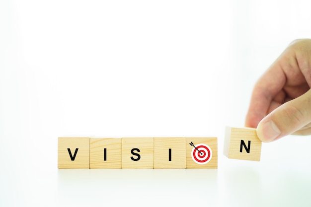 Word vision and mission on a wooden blocks business strategic\
planning concept