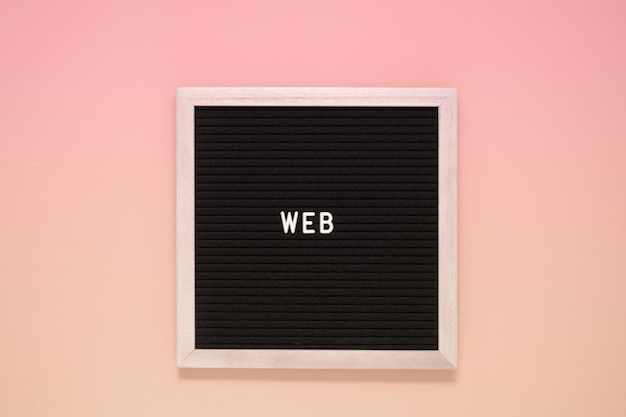 Photo the word web on black board on isolated beige background