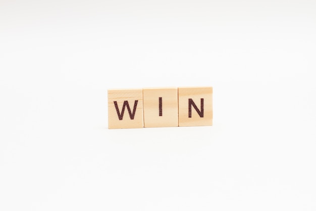 The word WIN is made of wooden cubes isolated