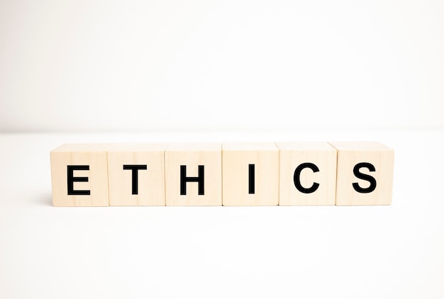 Word with dice on white background - ethics