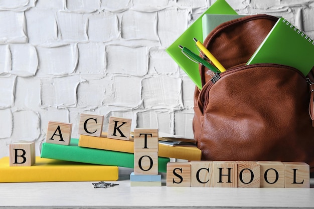 words back to school with stationery set on light background