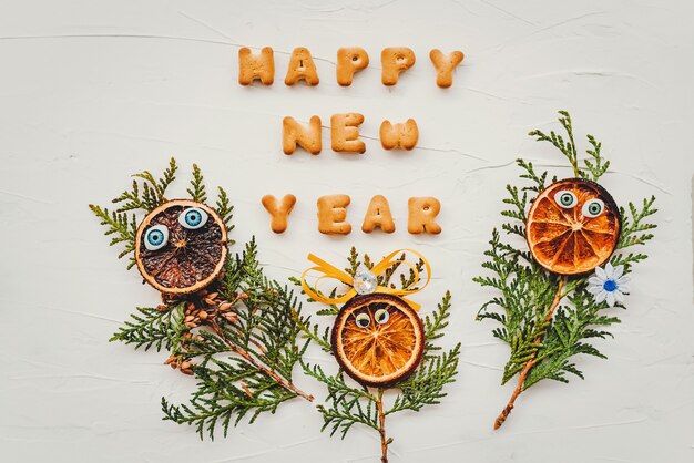 The words happy new year are written from cookie letters. Flat lay composition for greeting card.