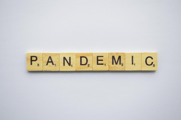 The words pandemic from scrabble letters on a white background
