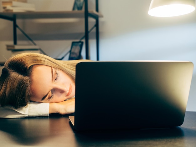 Work burnout exhaused employee sleeping on desk