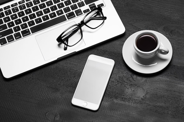 Work concept with laptop and phone on the table