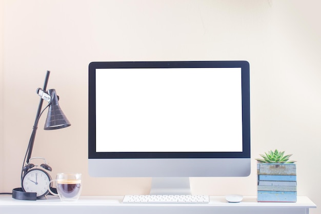 Work desk with computer copy space on blank screen