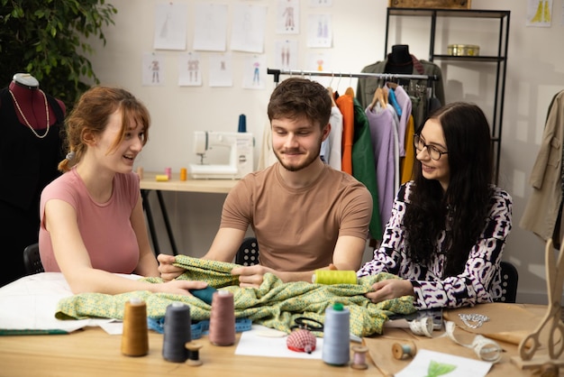 The work of fashion designer and tailors in the shop fashion designers working in their studio