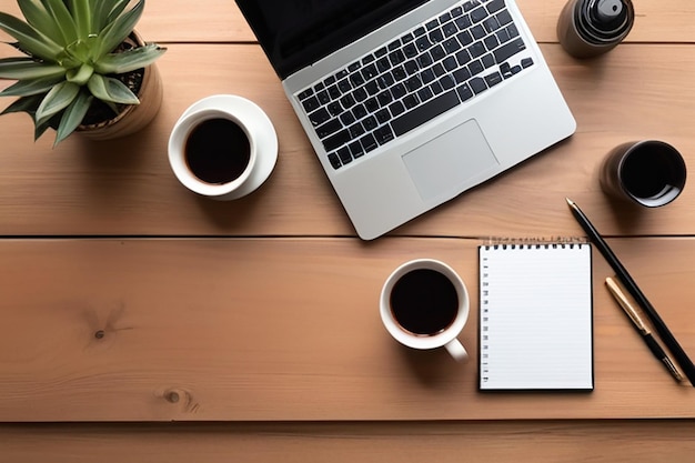 Work from home desk office with laptop blank notepad coffee cup and pen on wood table Flat lay top view copy spce