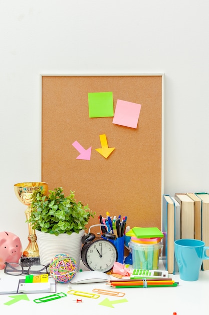 Work place of a creative person with a variety of colorful stationery objects