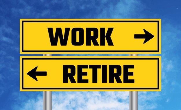 Work or retire road sign on blue sky background